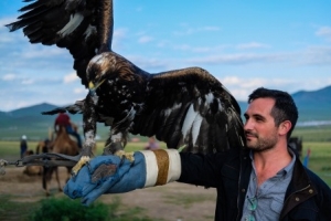 Fulbright recipient Jake Kennedy with eagle in Mongolia 